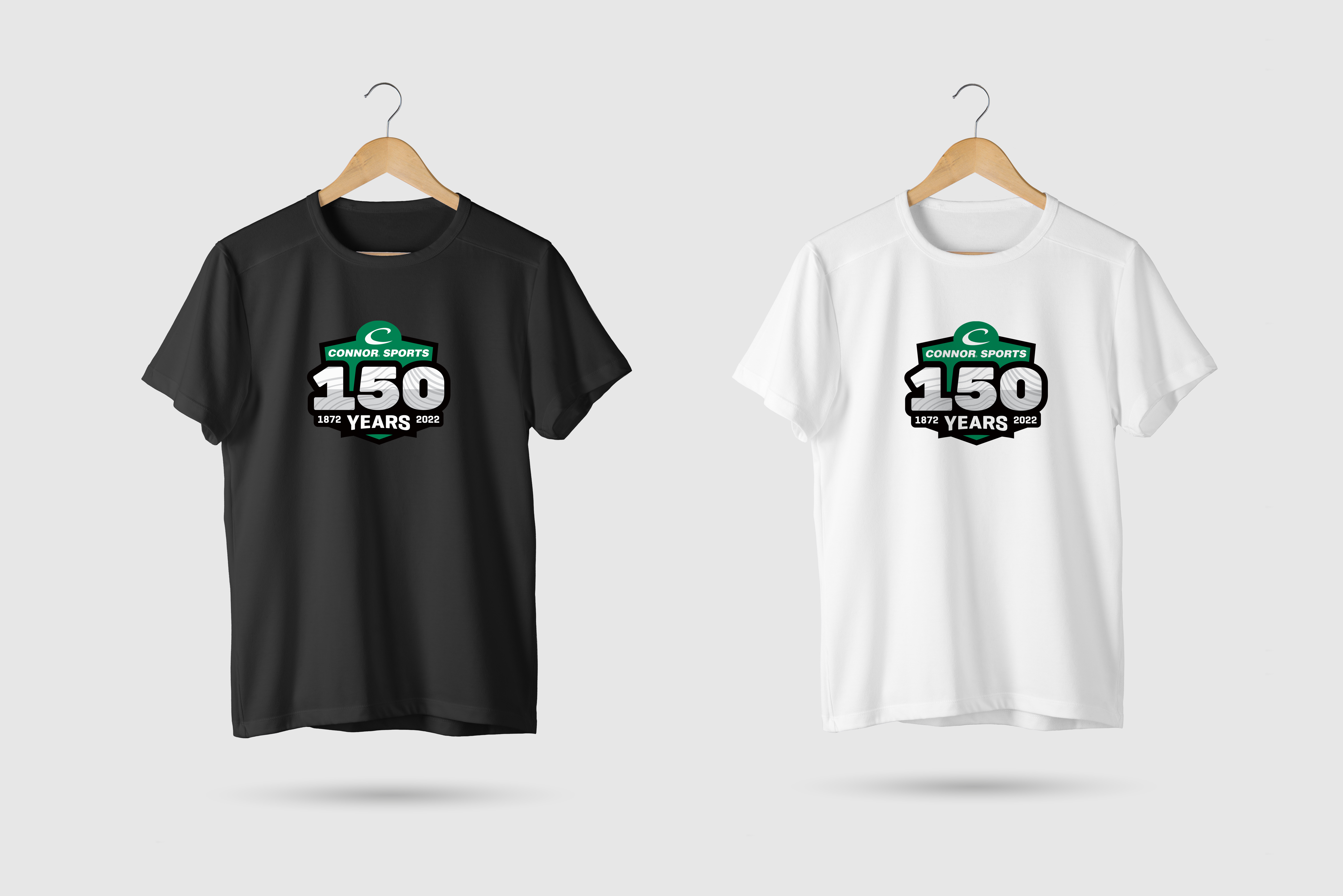 Black and white t-shirts with the Connor Sports Anniversary Logo